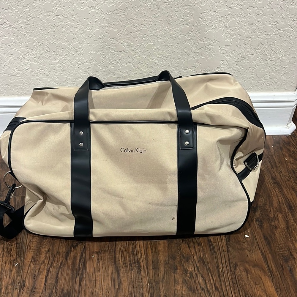 Calvin Klein roller luggage perfect for a carry-on use have some stain